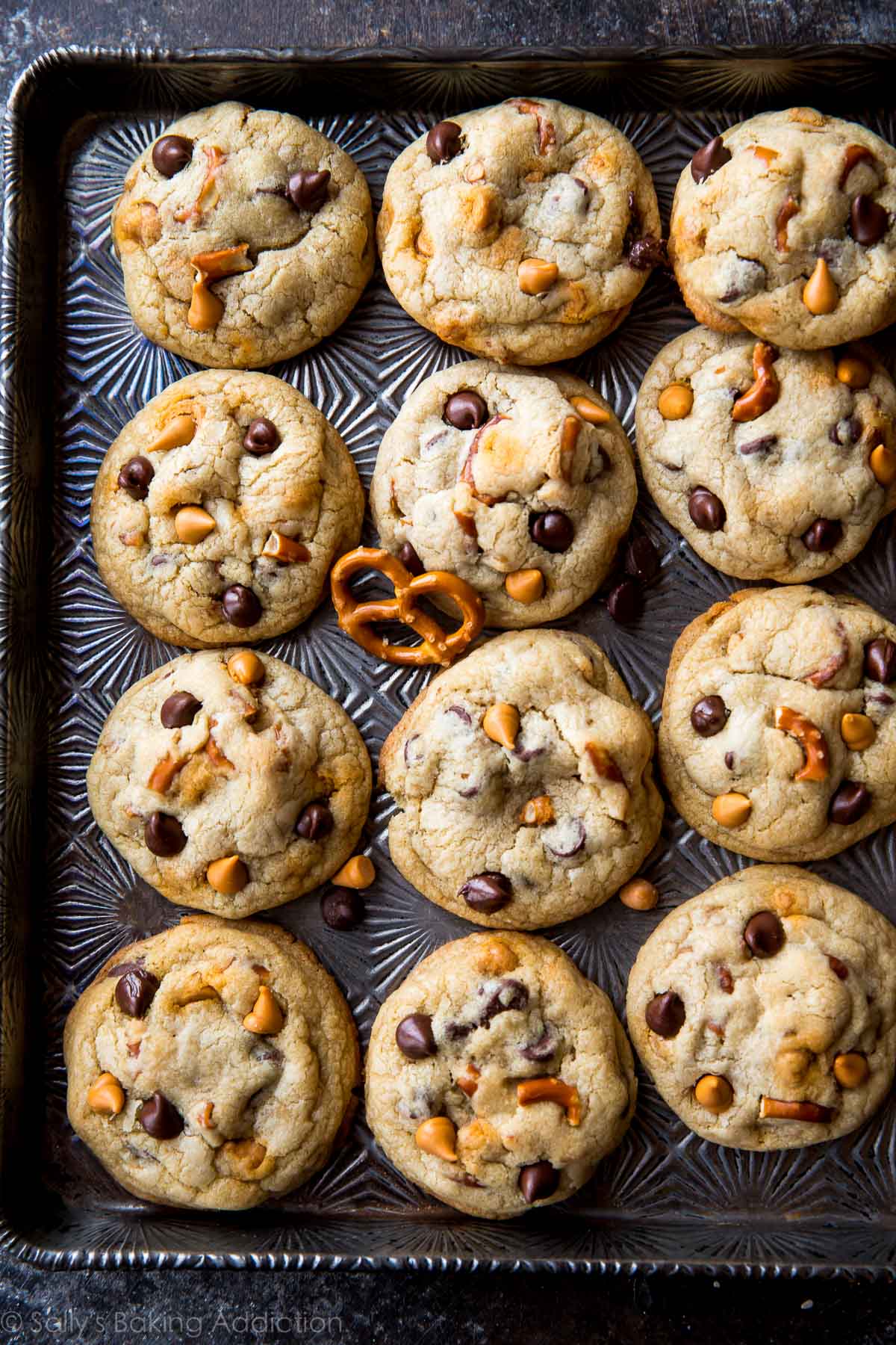 butterscotch pretzel chocolate chip cookies on a baking sheet