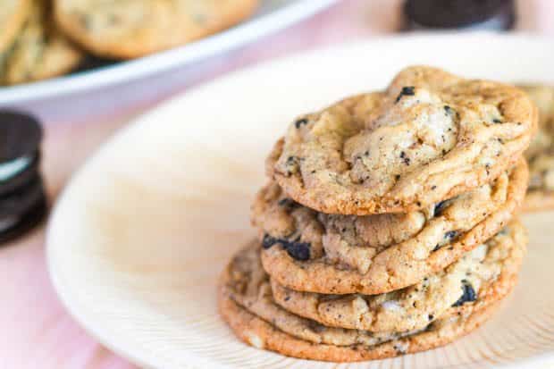 stack of oreo cheesecake cookies on a cream plate