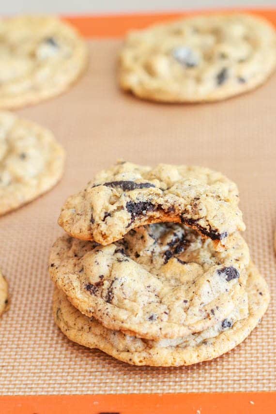 stack of oreo cheesecake cookies on a silpat baking mat