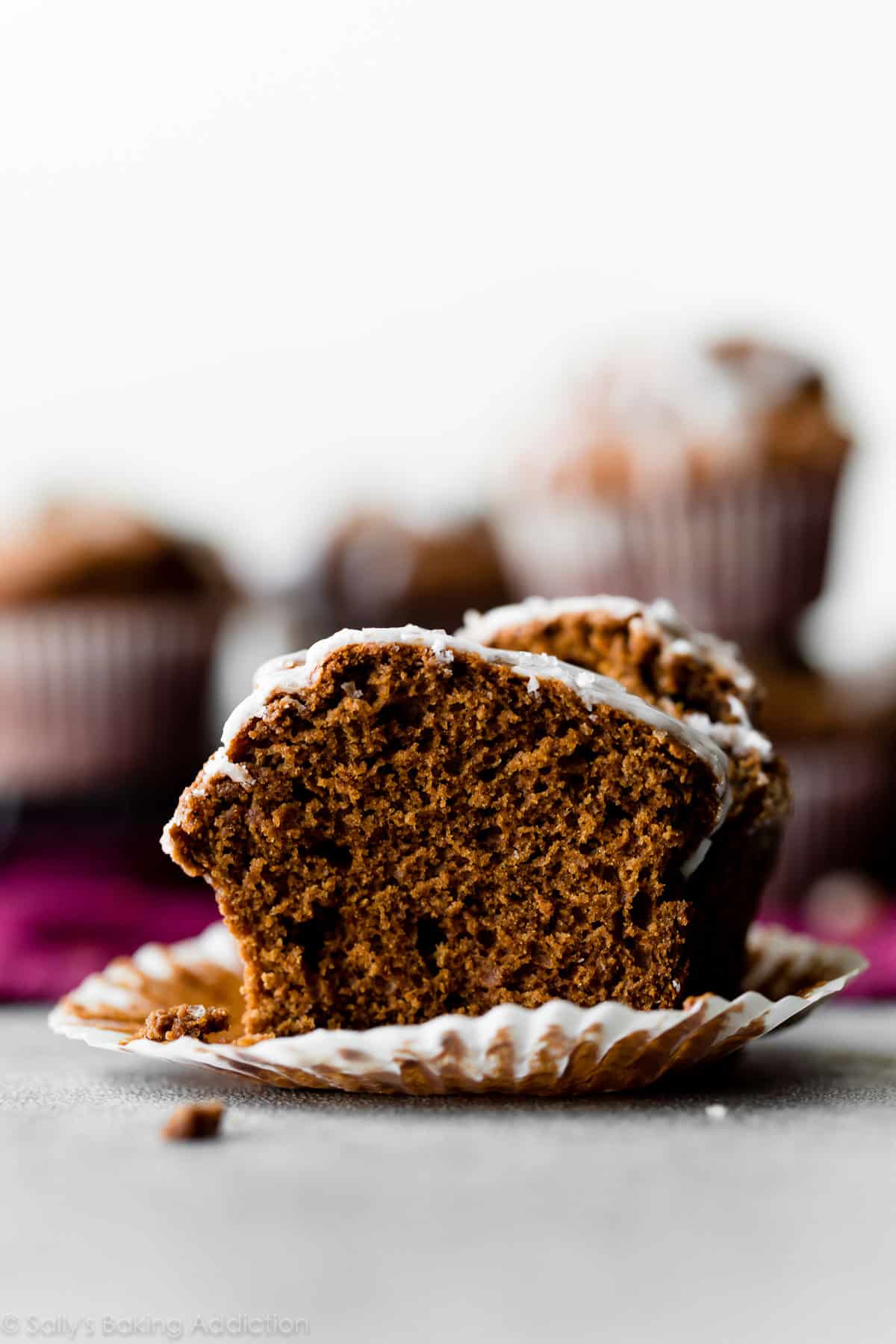 gingerbread muffin cut in half with lemon glaze