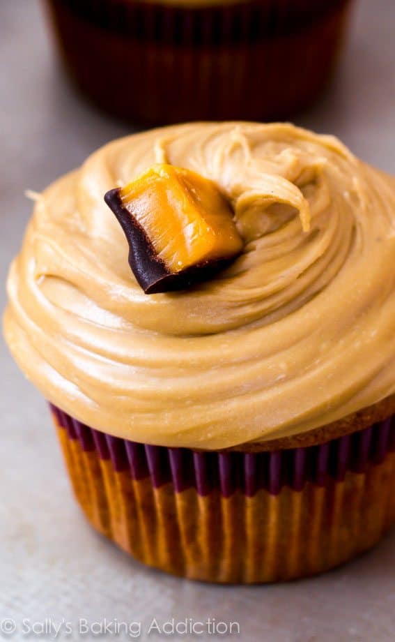 caramel cupcakes topped with salted caramel frosting and caramel candies