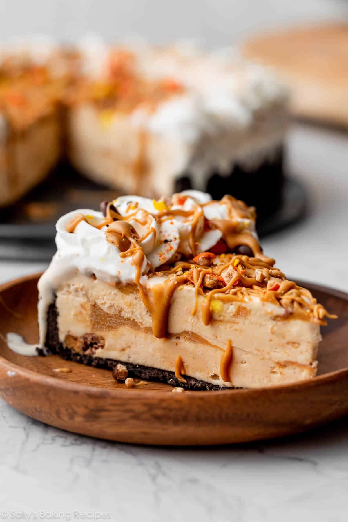 slice of peanut butter ice cream pie on wooden plate.