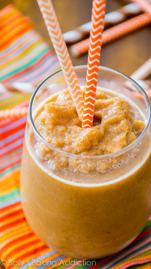 pumpkin frappuccino in a glass with straws