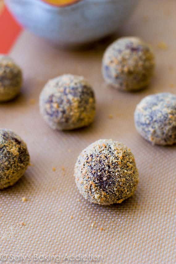 s'mores chocolate crinkle cookie dough balls on a silpat baking mat