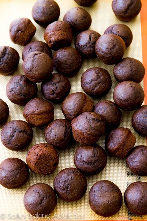 chocolate donut holes without glaze on a silpat baking mat