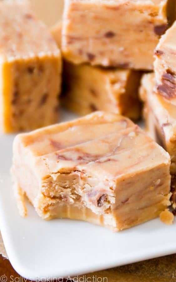 squares of peanut butter fudge with a bite taken out of one piece