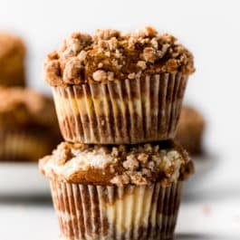 stack of pumpkin cheesecake muffins