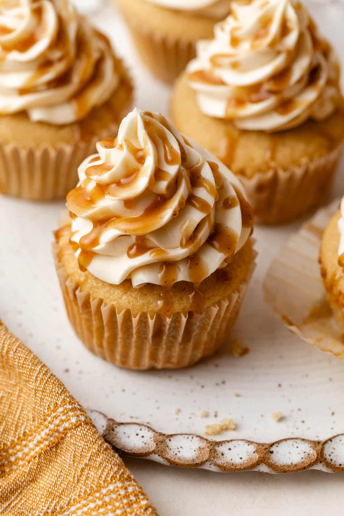 butterscotch cupcakes with butterscotch sauce and vanilla buttercream.