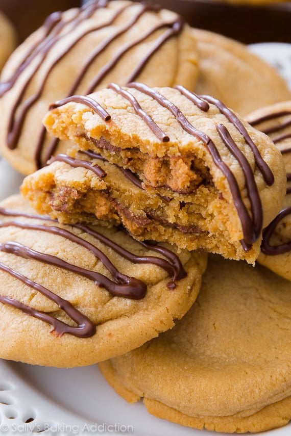 Reese's stuffed peanut butter cookies with one broken in half showing peanut butter cup on the inside