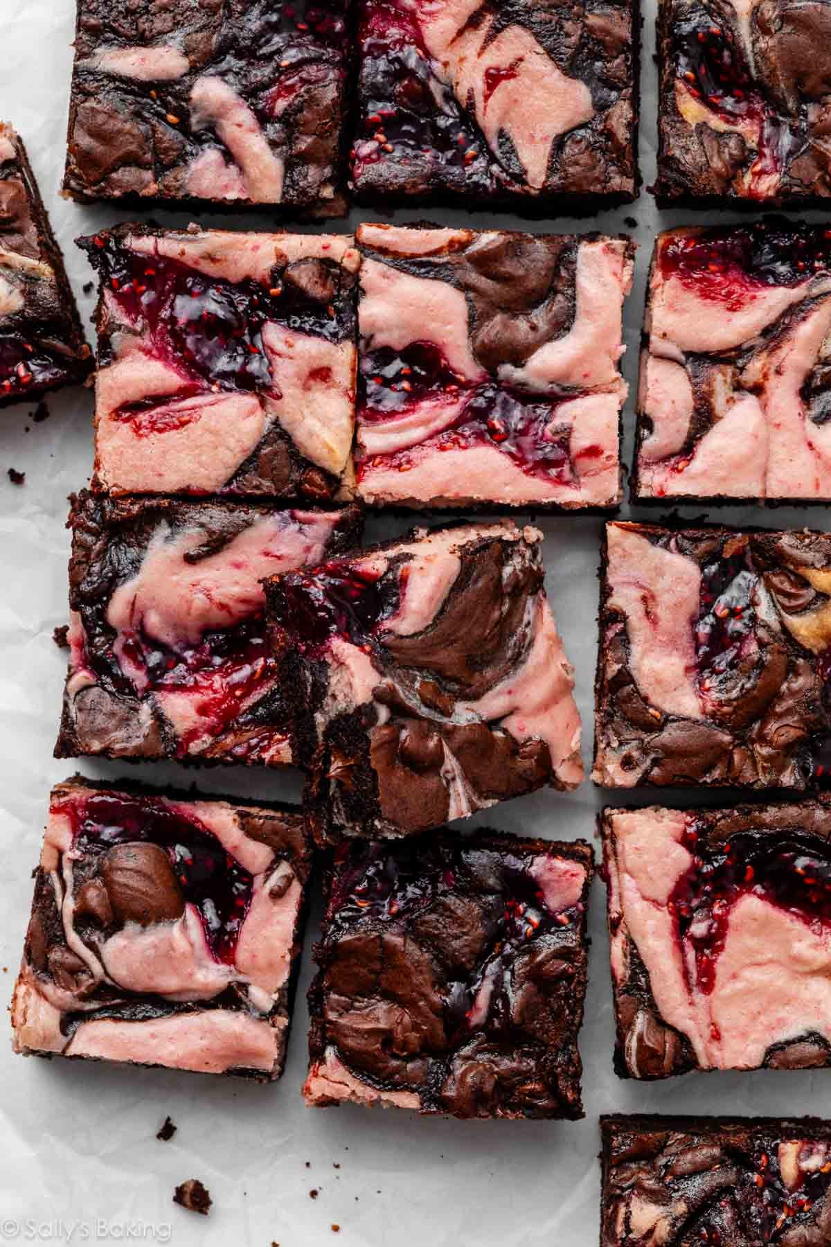raspberry cheesecake brownies cut into squares.