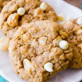 white chocolate macadamia nut oatmeal cookies on a white plate