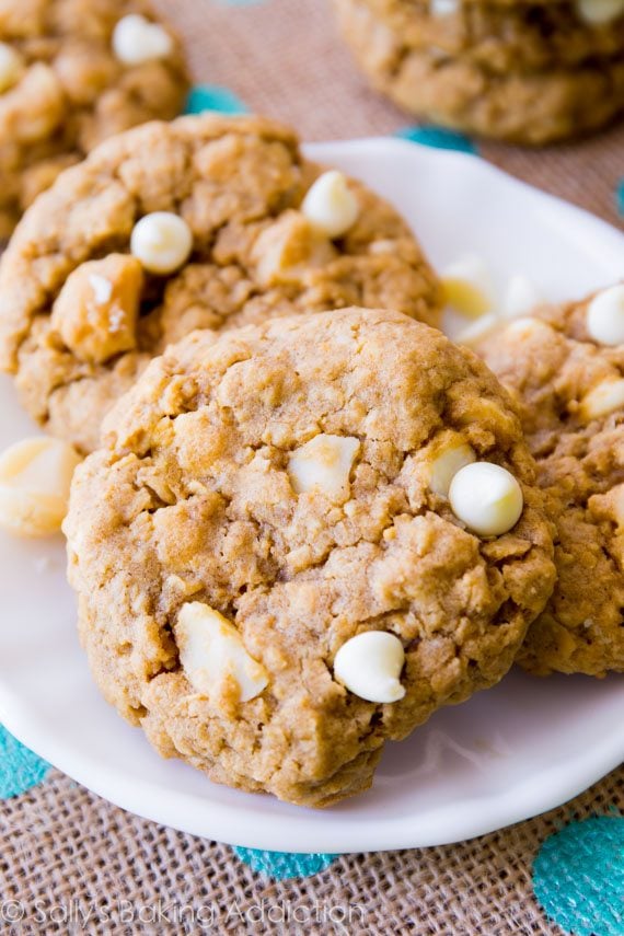 white chocolate macadamia nut oatmeal cookies on a white plate
