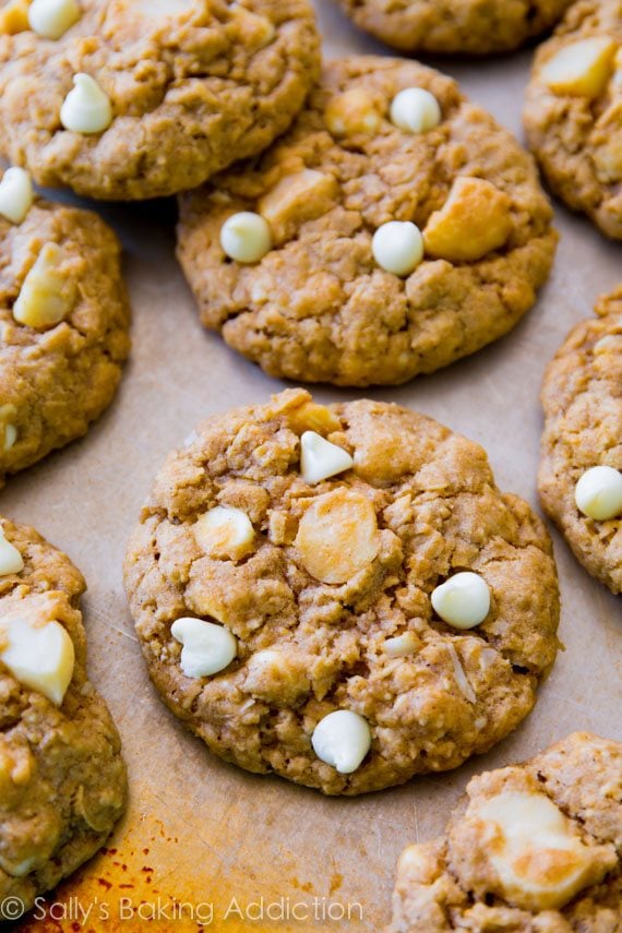 white chocolate macadamia nut oatmeal cookies on a baking sheet