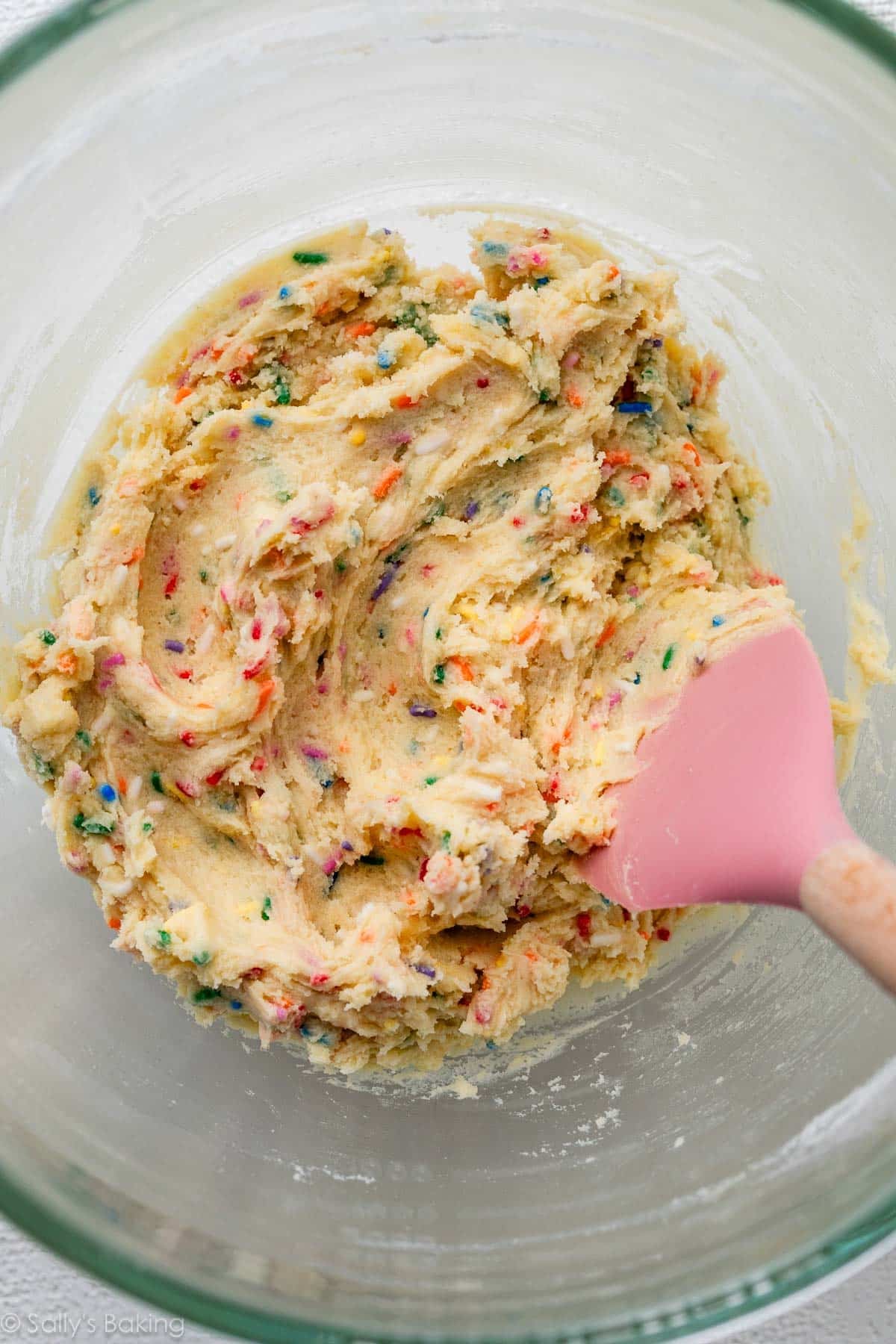 dough with sprinkles in glass bowl.
