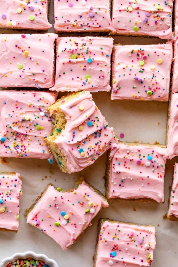 sugar cookie bars with frosting and sprinkles.