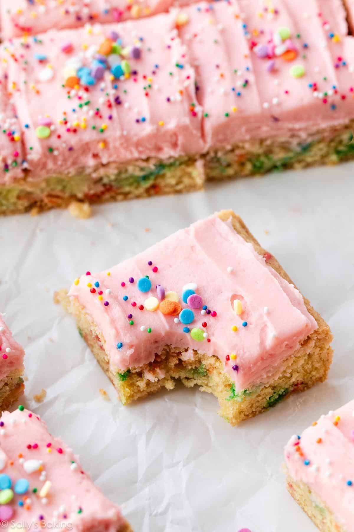 sugar cookie bar with pink buttercream frosting.