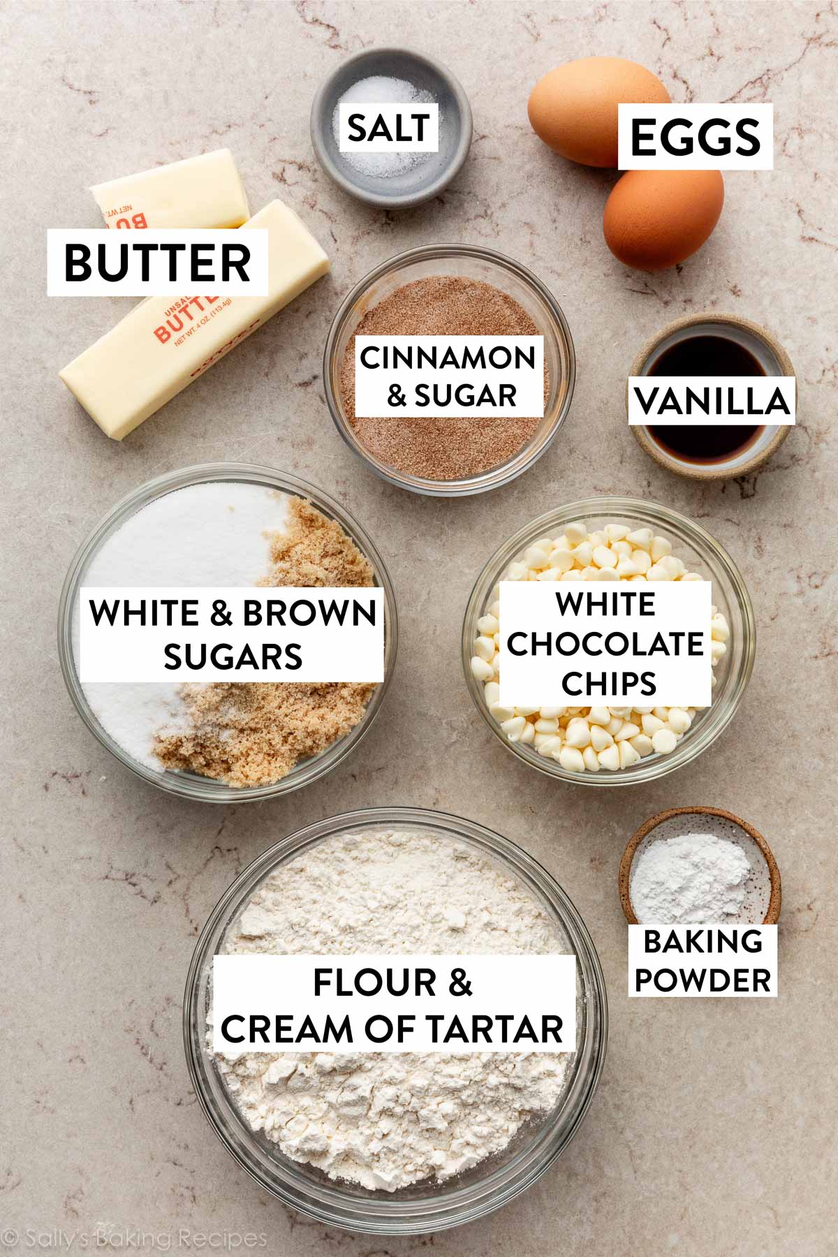 ingredients measured out including white chocolate chips, vanilla, eggs, salt, flour, and butter.