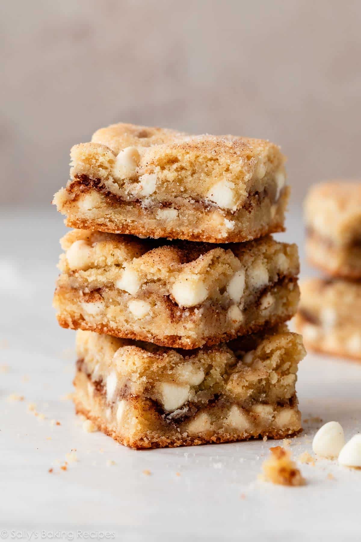 stack of 3 snickerdoodle blondies with white chocolate chips.