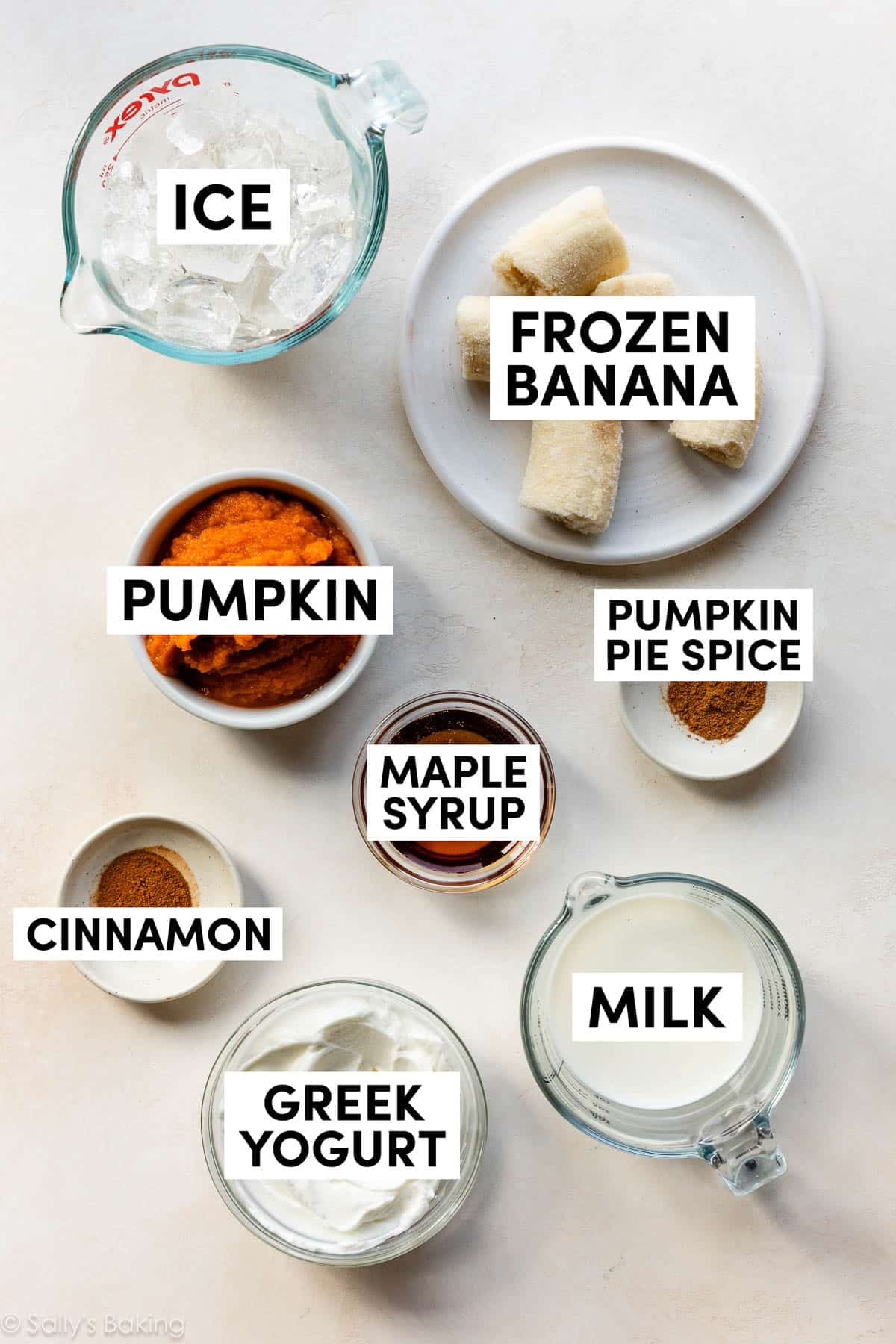 ingredients in bowls including milk, greek yogurt, and pumpkin.