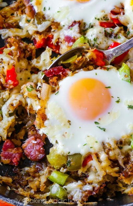 crispy hash breakfast skillet with a serving spoon