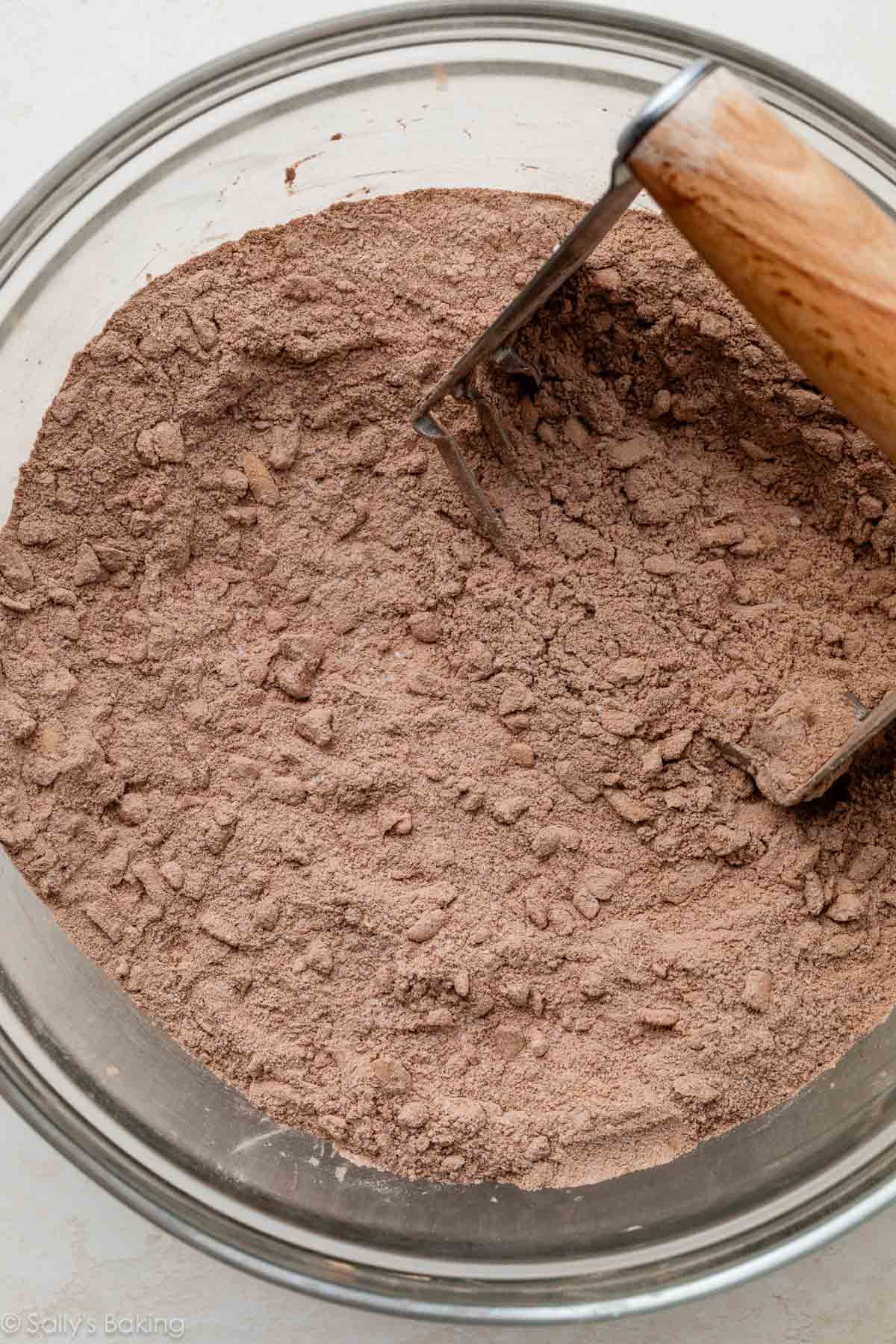 dry ingredients in bowl with pastry cutter.