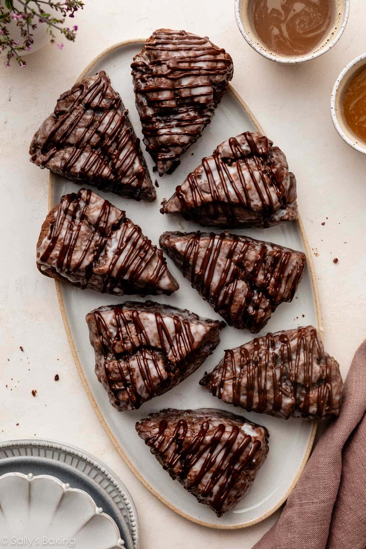 glazed chocolate scones on oval platter.