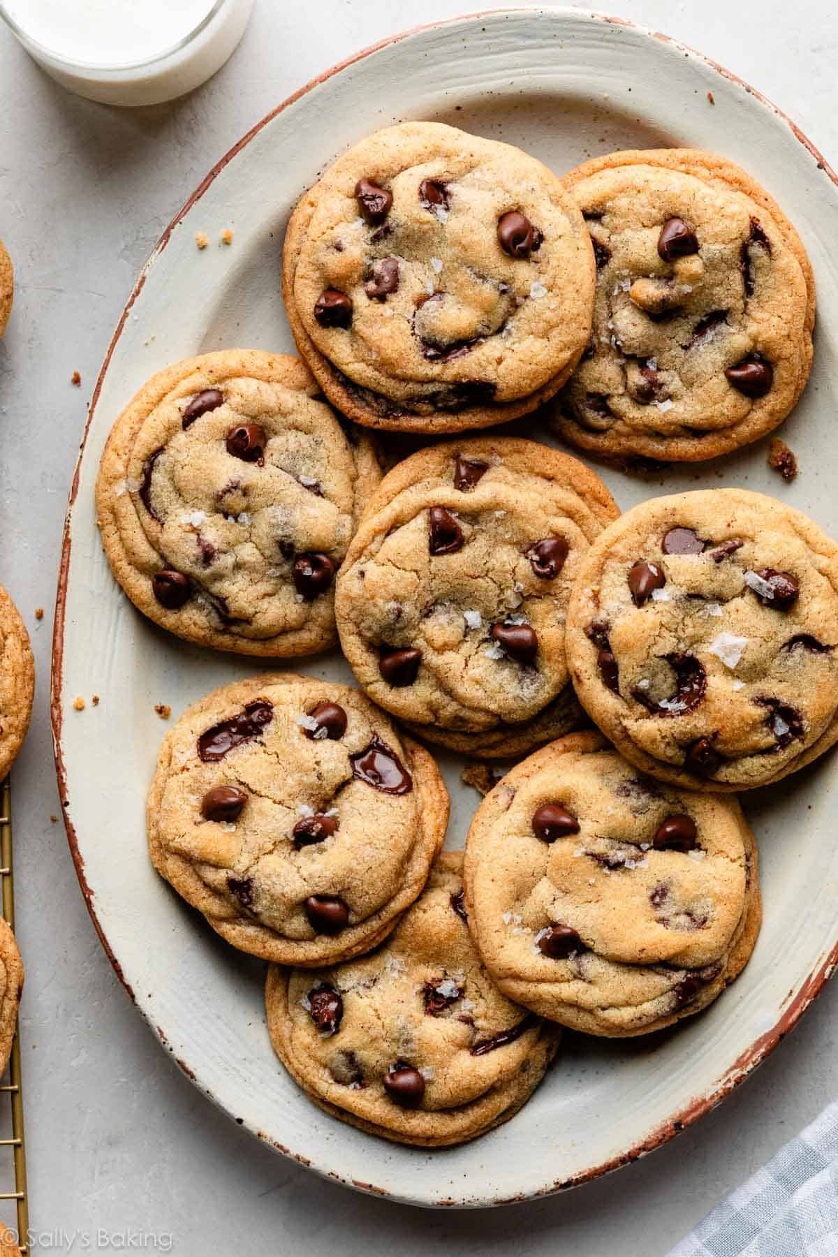 brown butter chocolate chip cookies with sea salt on oval plater.