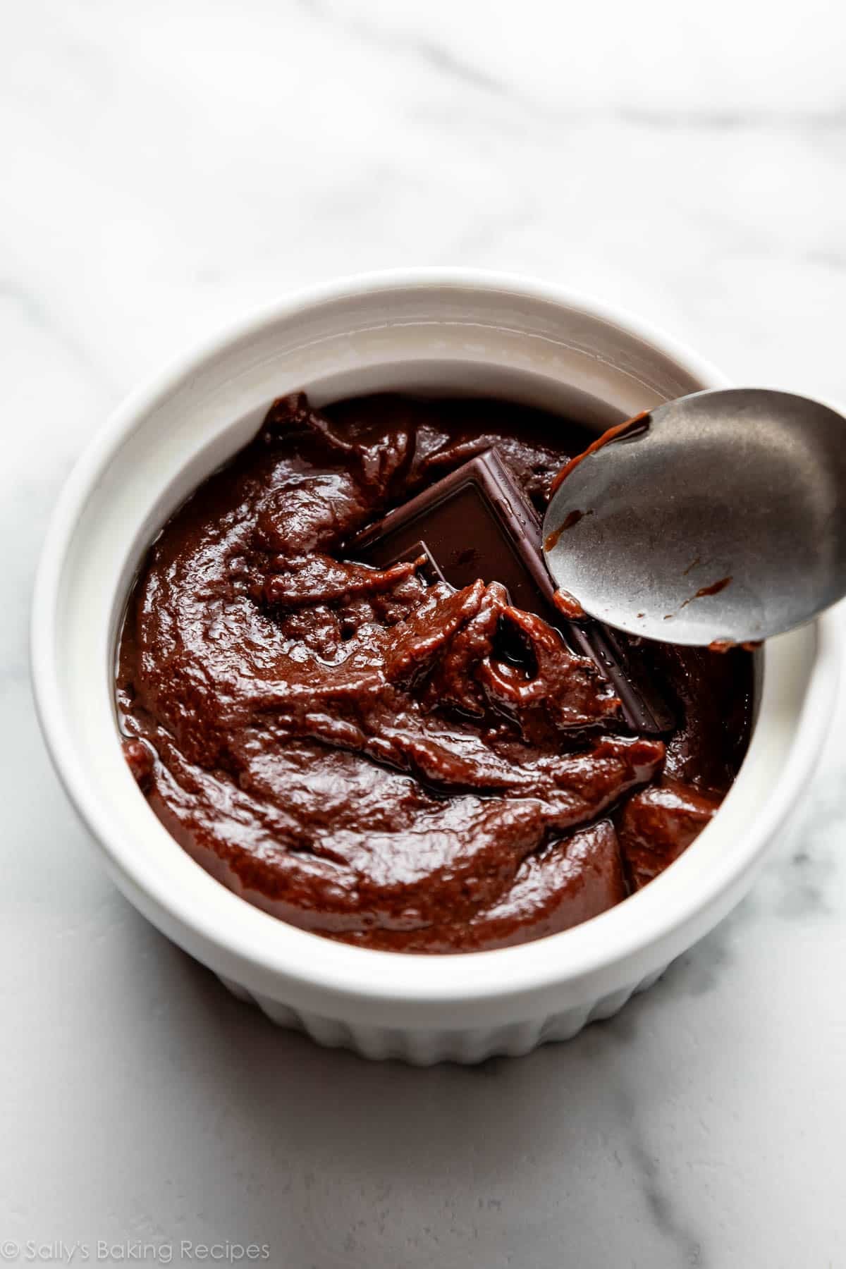 chocolate square and batter in ramekin.