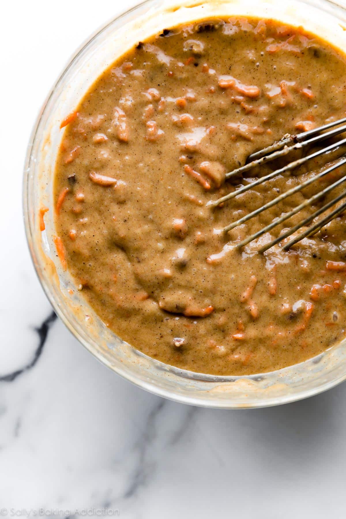 Carrot cake batter in a glass bowl