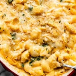 close up overhead photo of butternut squash mac and cheese with kale.