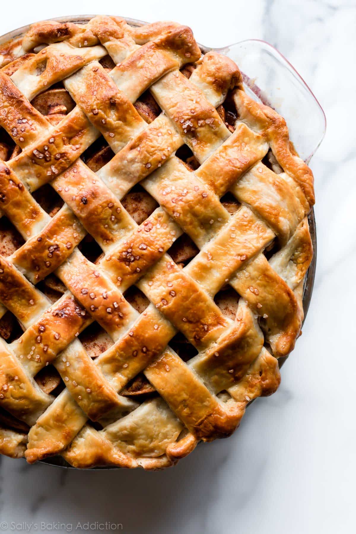 chai spice apple pie in a glass pie dish