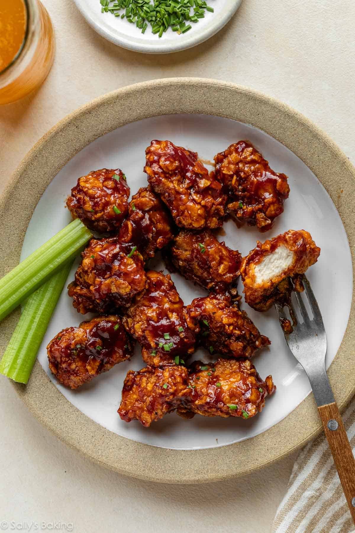 plate of honey bbq chicken with celery.