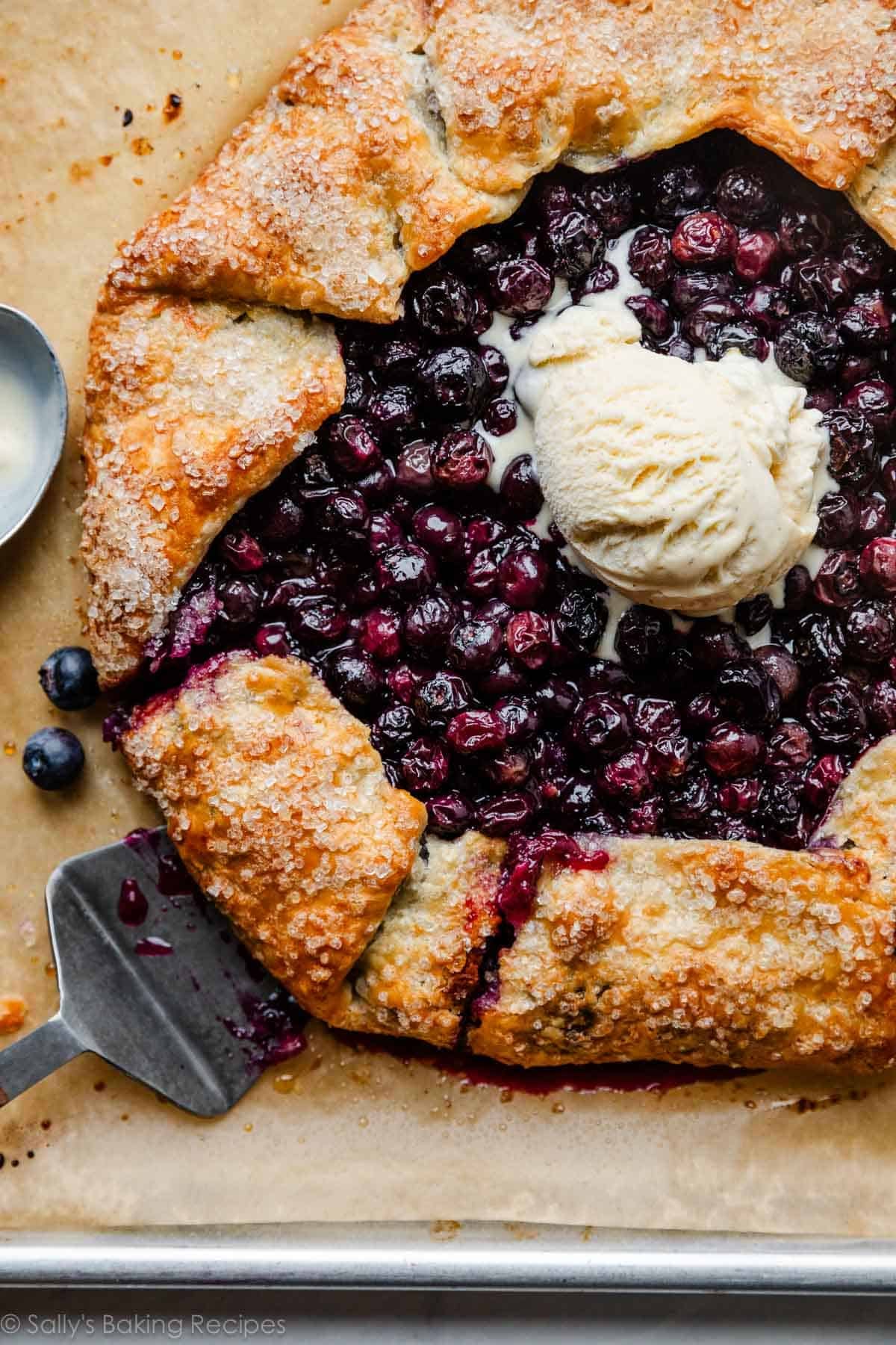 blueberry galette with vanilla ice cream scoop on top.