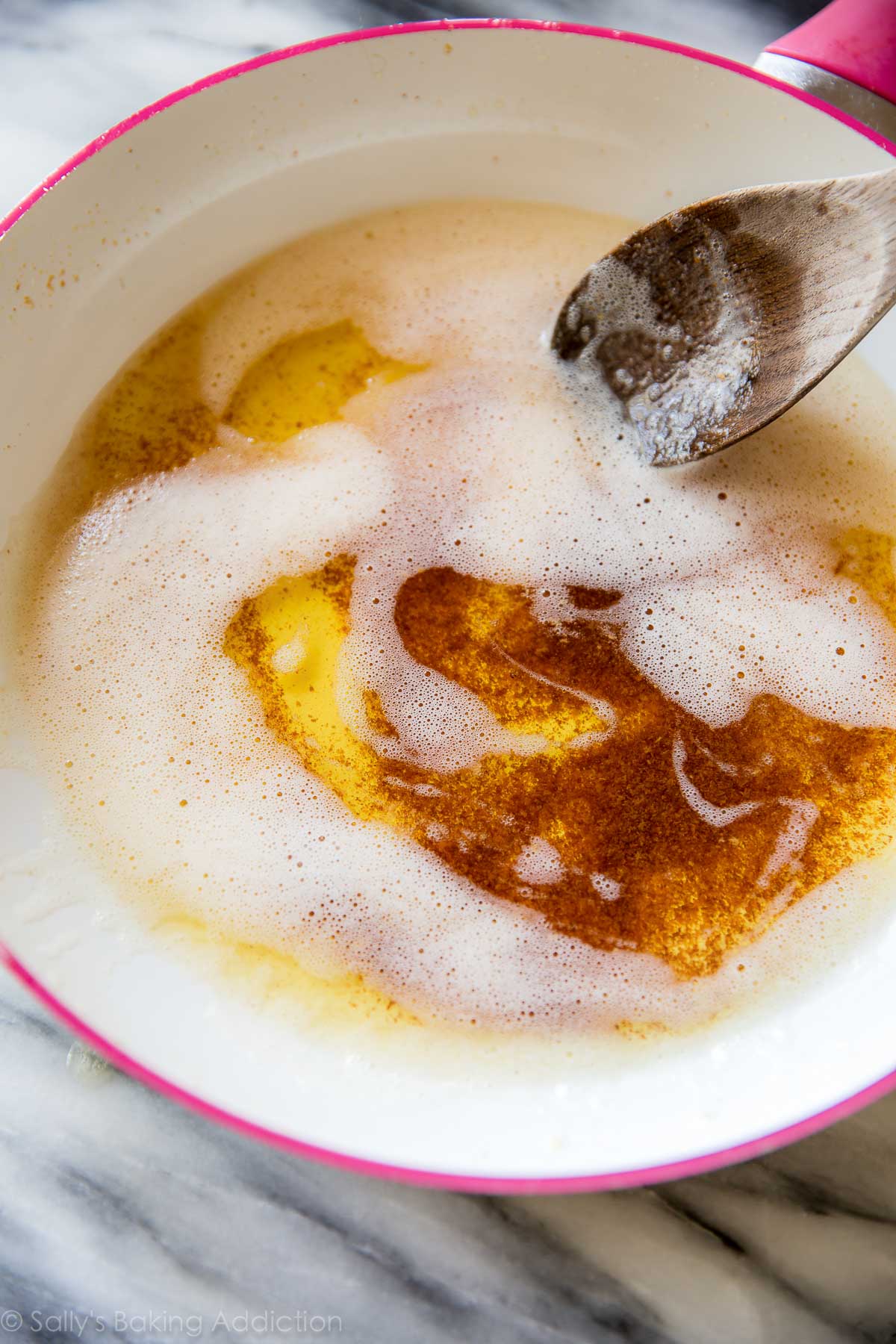 brown butter in a skillet with a wood spoon