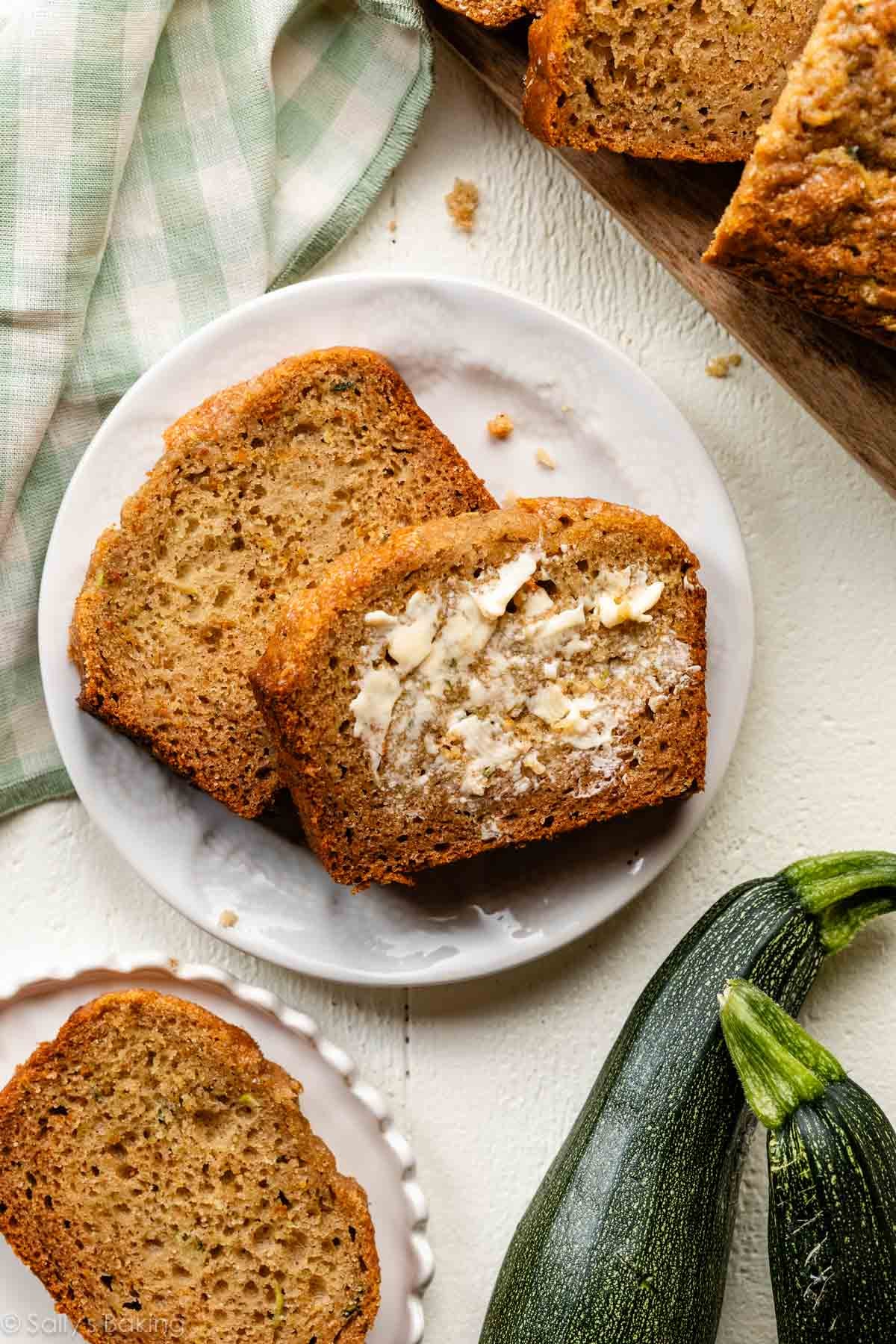 slices of greek yogurt zucchini bread on white plate.