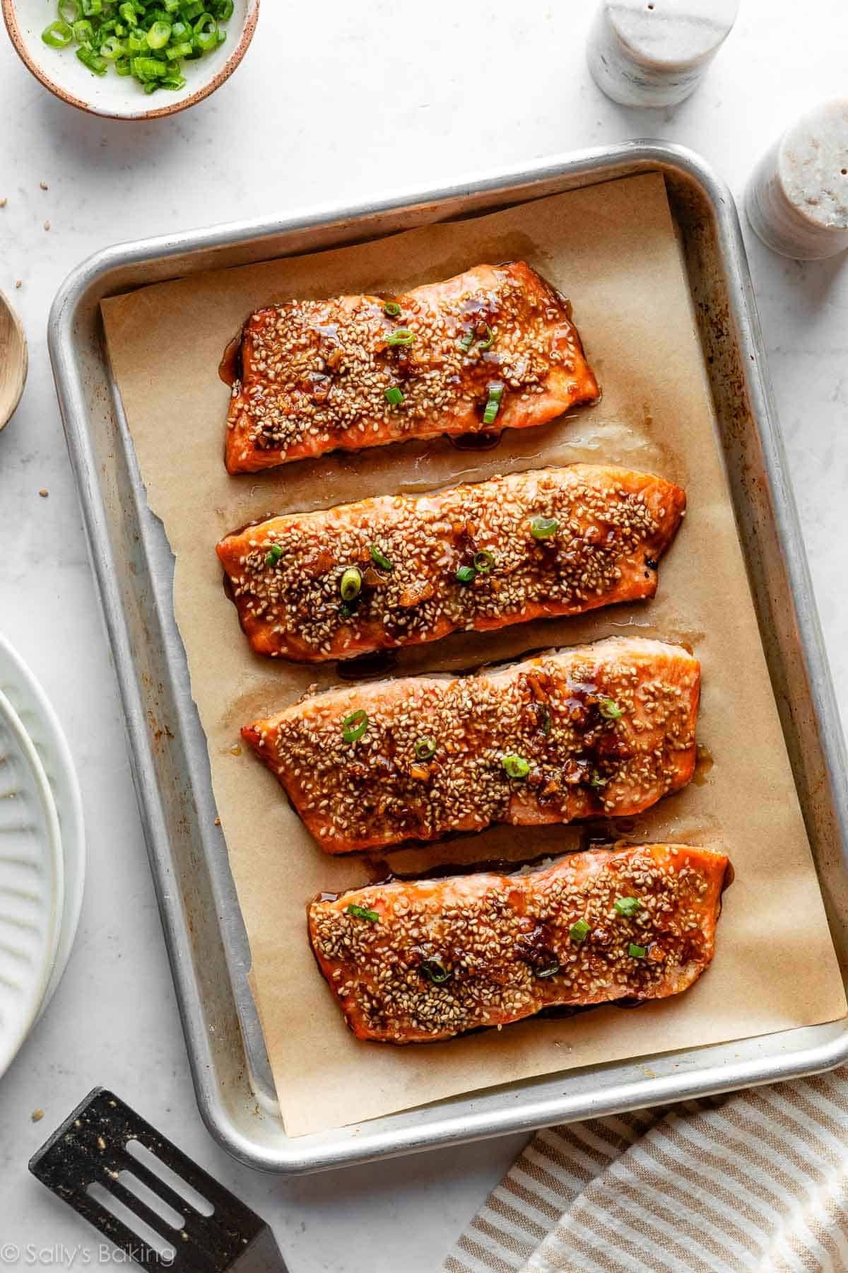maple sesame salmon on baking sheet.