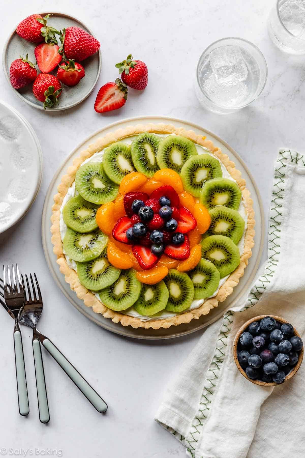 fresh fruit tart with mascarpone cream filling on a crust.