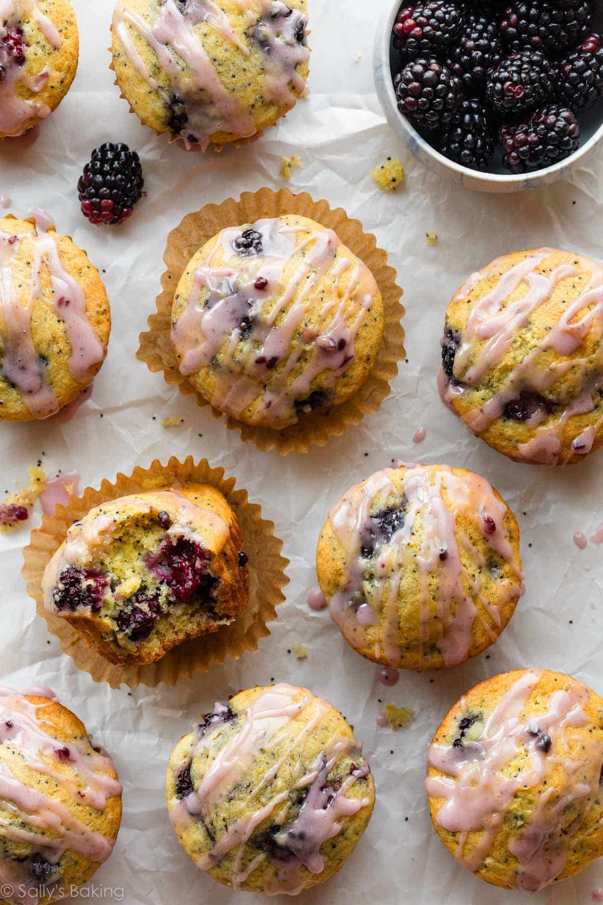 blackberry lemon poppy seed muffins with pink icing.