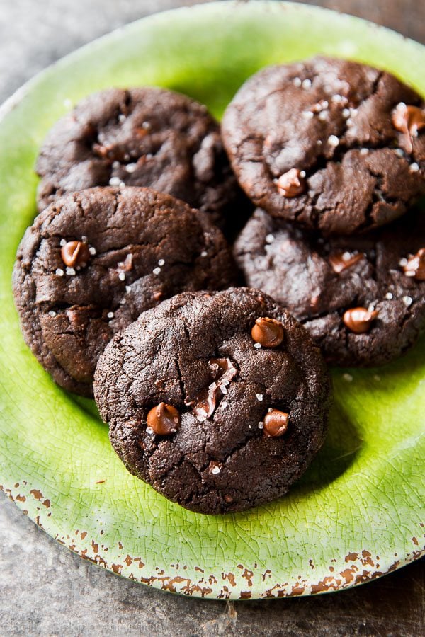 salted dark chocolate cookies on a green plate