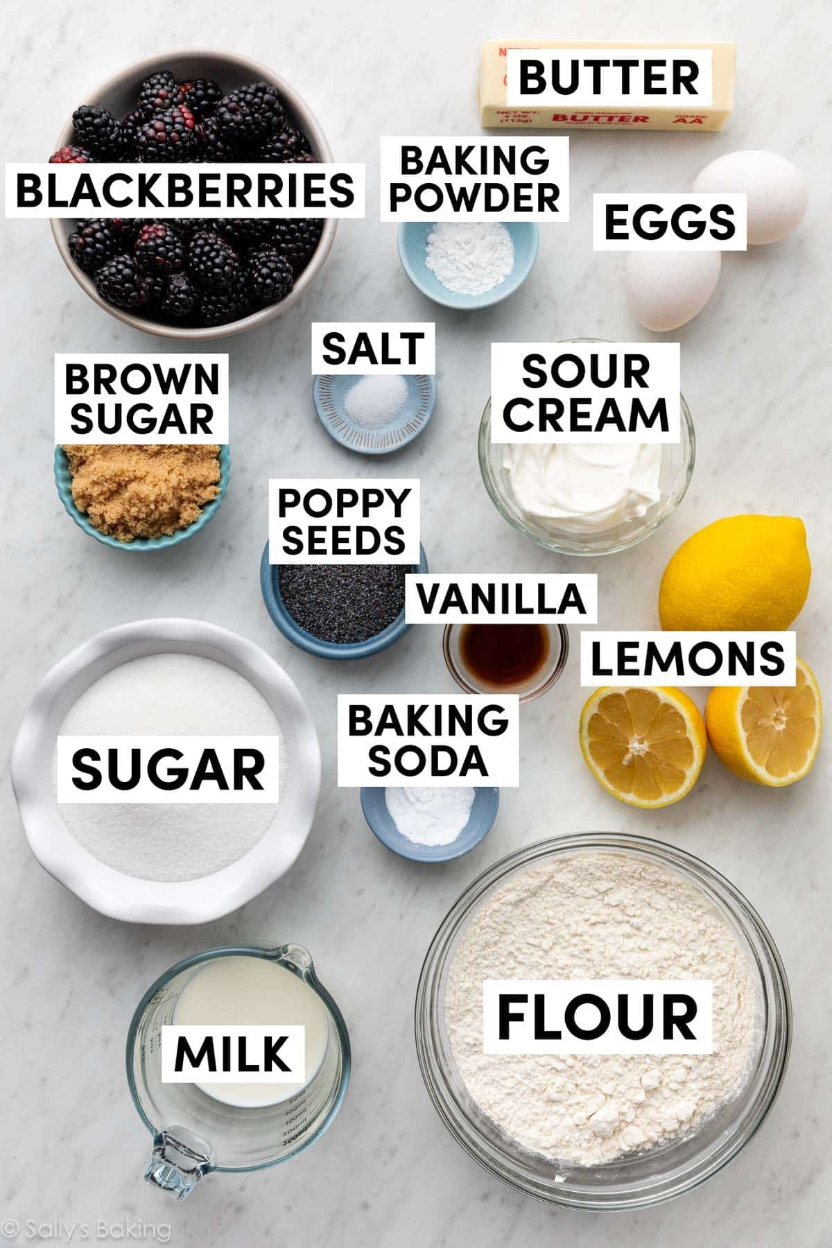 ingredients in bowls including flour, milk, sugar, brown sugar, sour cream, eggs, and baking powder.