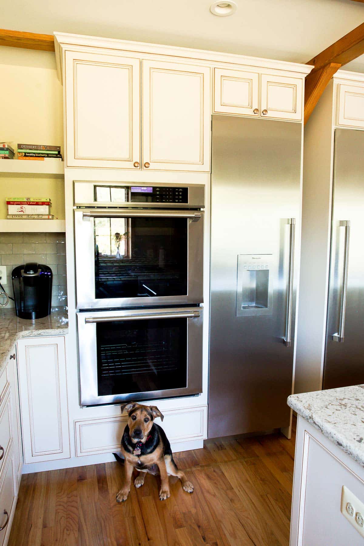 kitchen remodel with double ovens and refrigerator installed