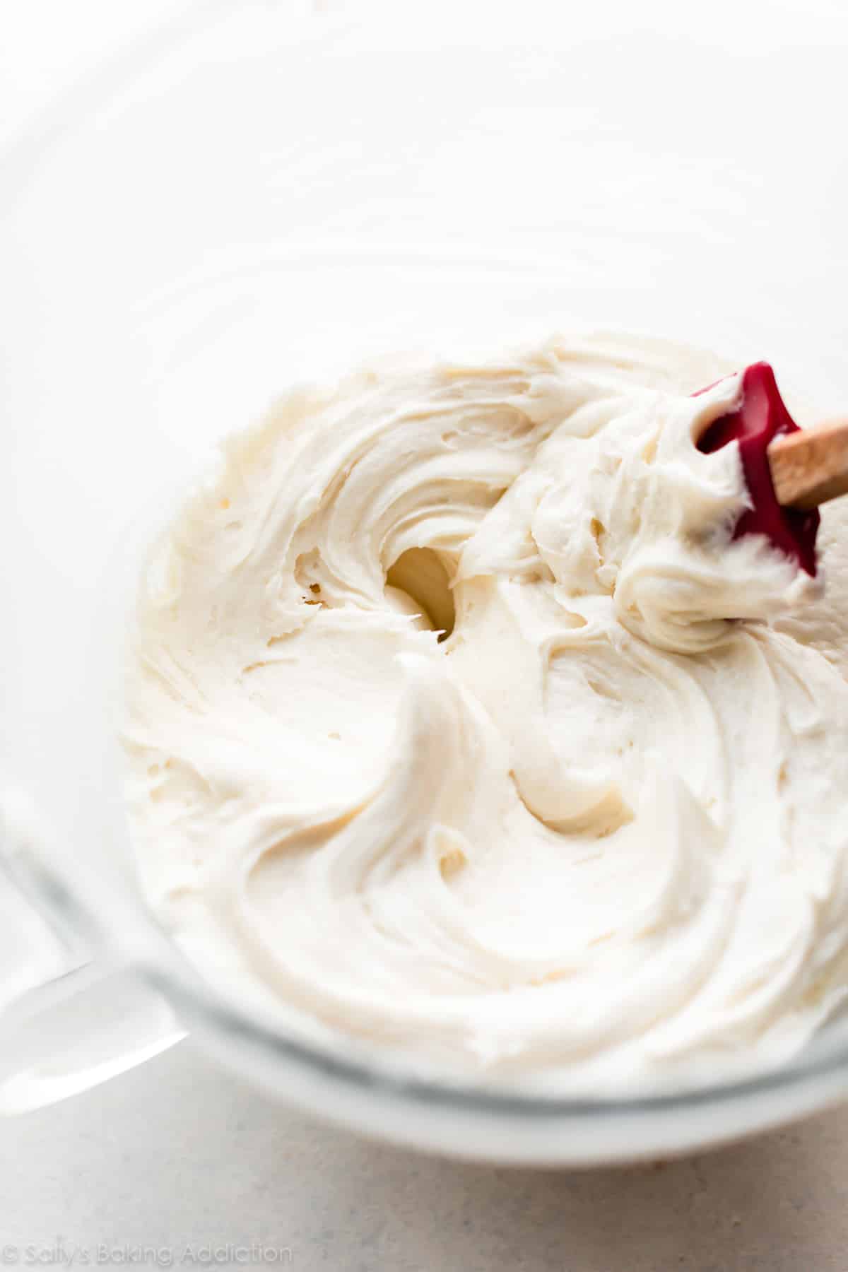 Cream cheese frosting in glass bowl