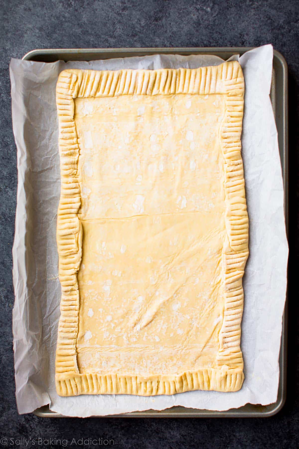 rectangle crust for honey pear tart on a parchment paper lined baking sheet