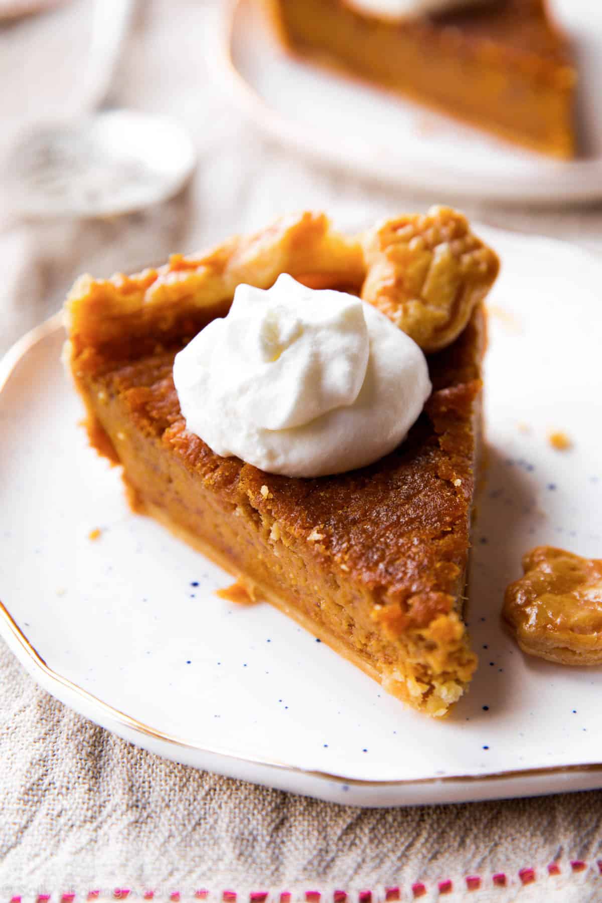 slice of sweet potato pie with whipped cream