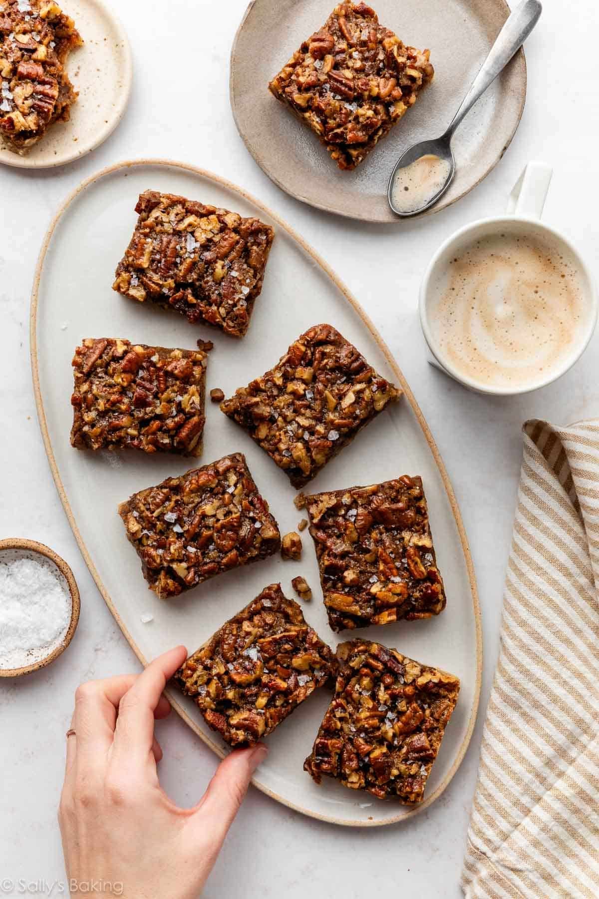 salted brown butter pecan pie bars on plate.