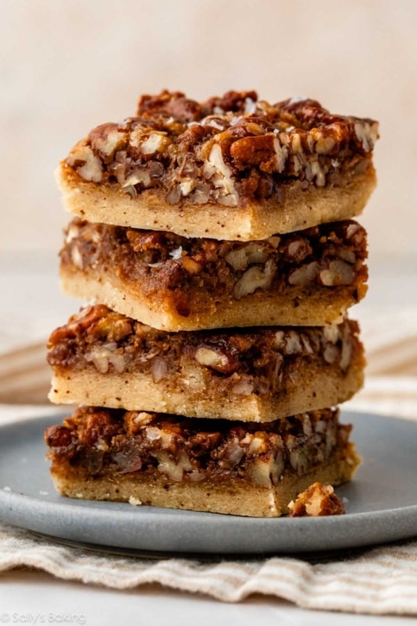 stack of pecan pie bars on plate.