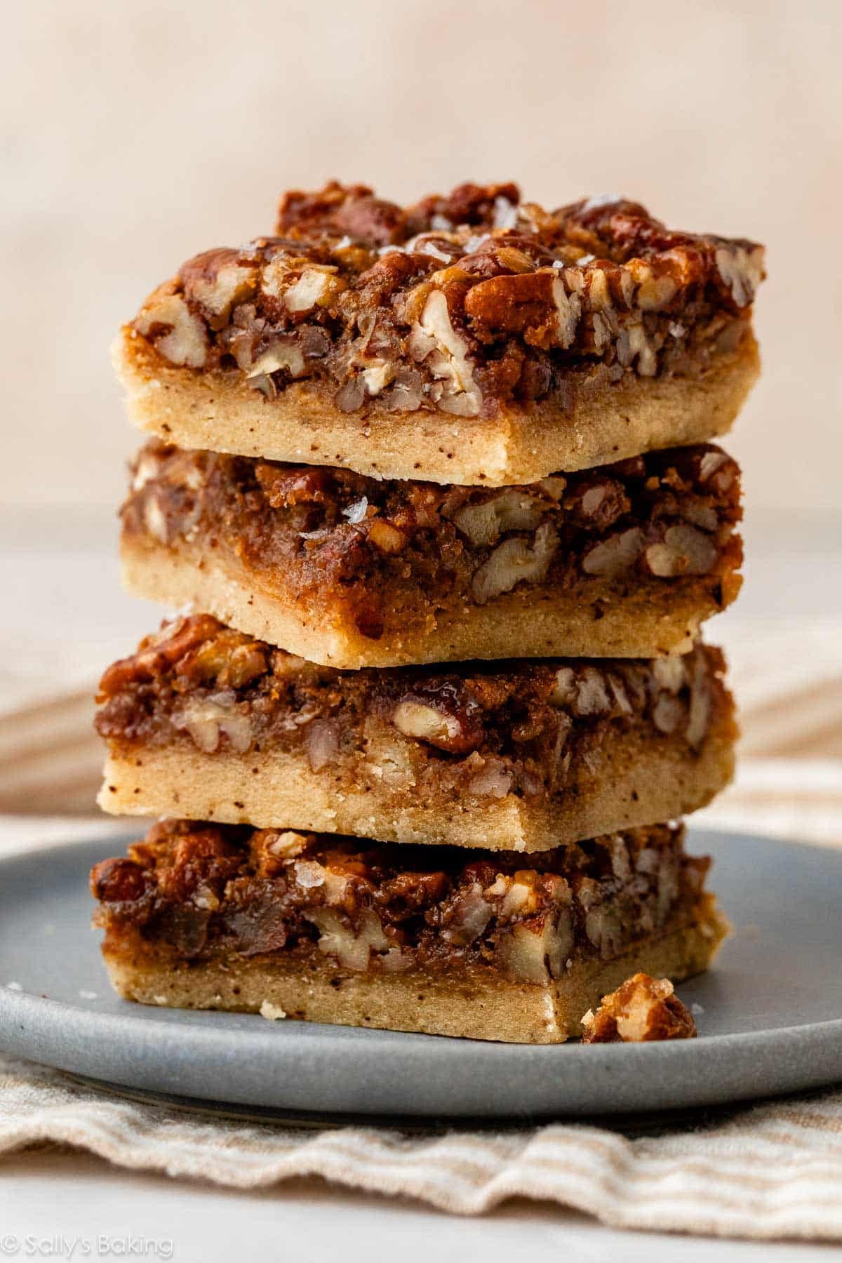 stack of pecan pie bars on plate.
