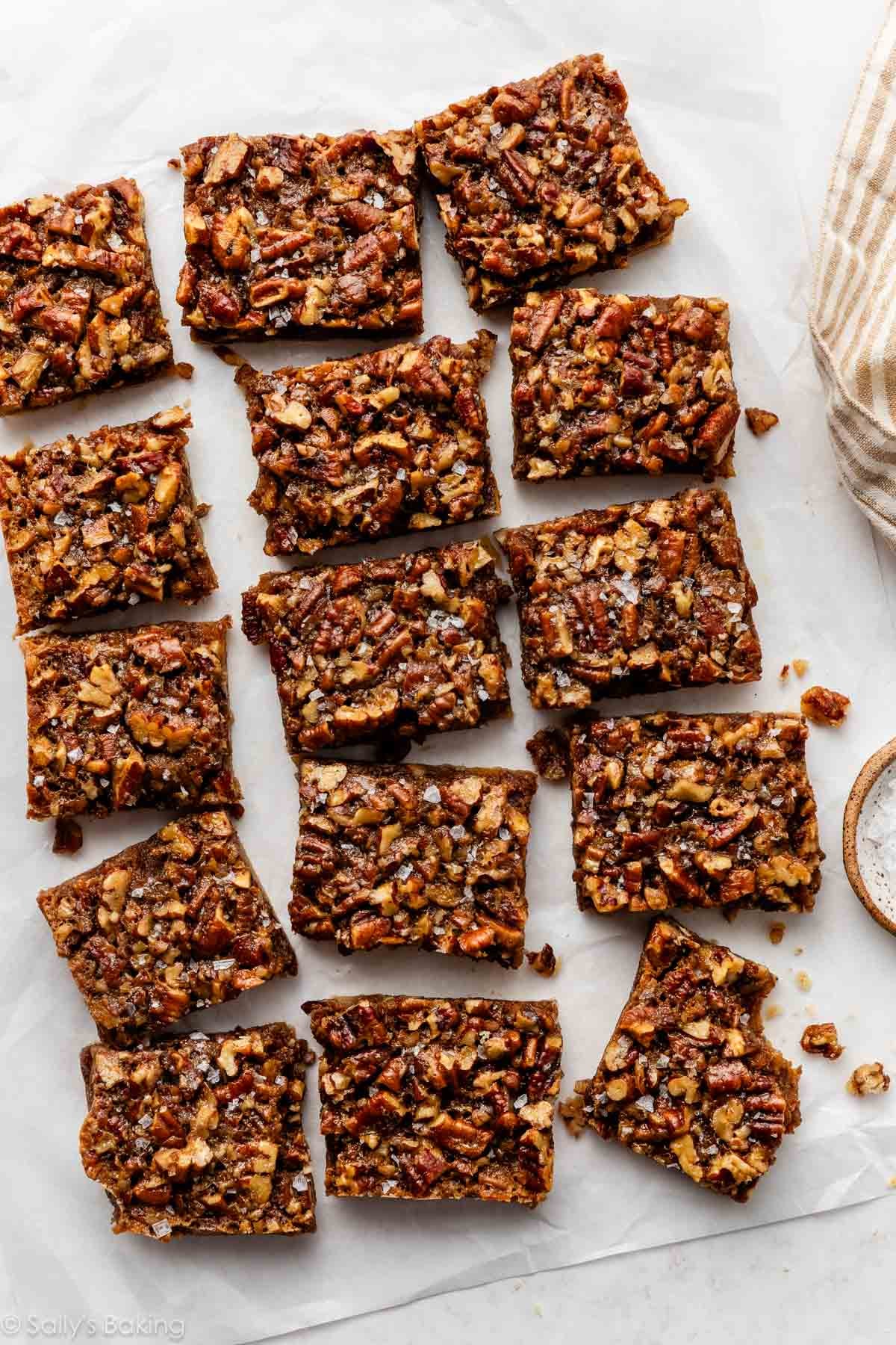 pecan pie bars with flaky sea salt on top.