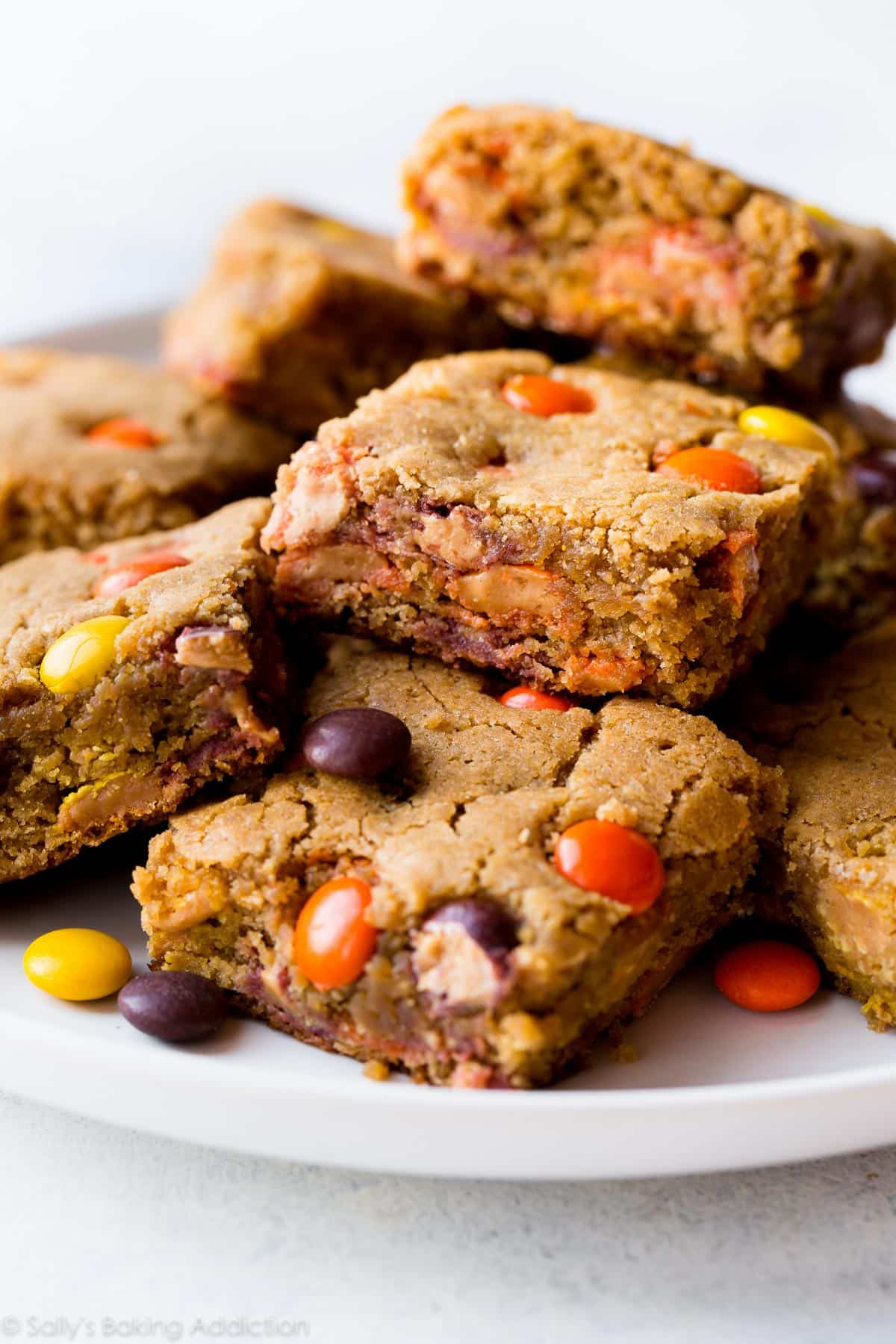 peanut butter blondies with reeses pieces inside.