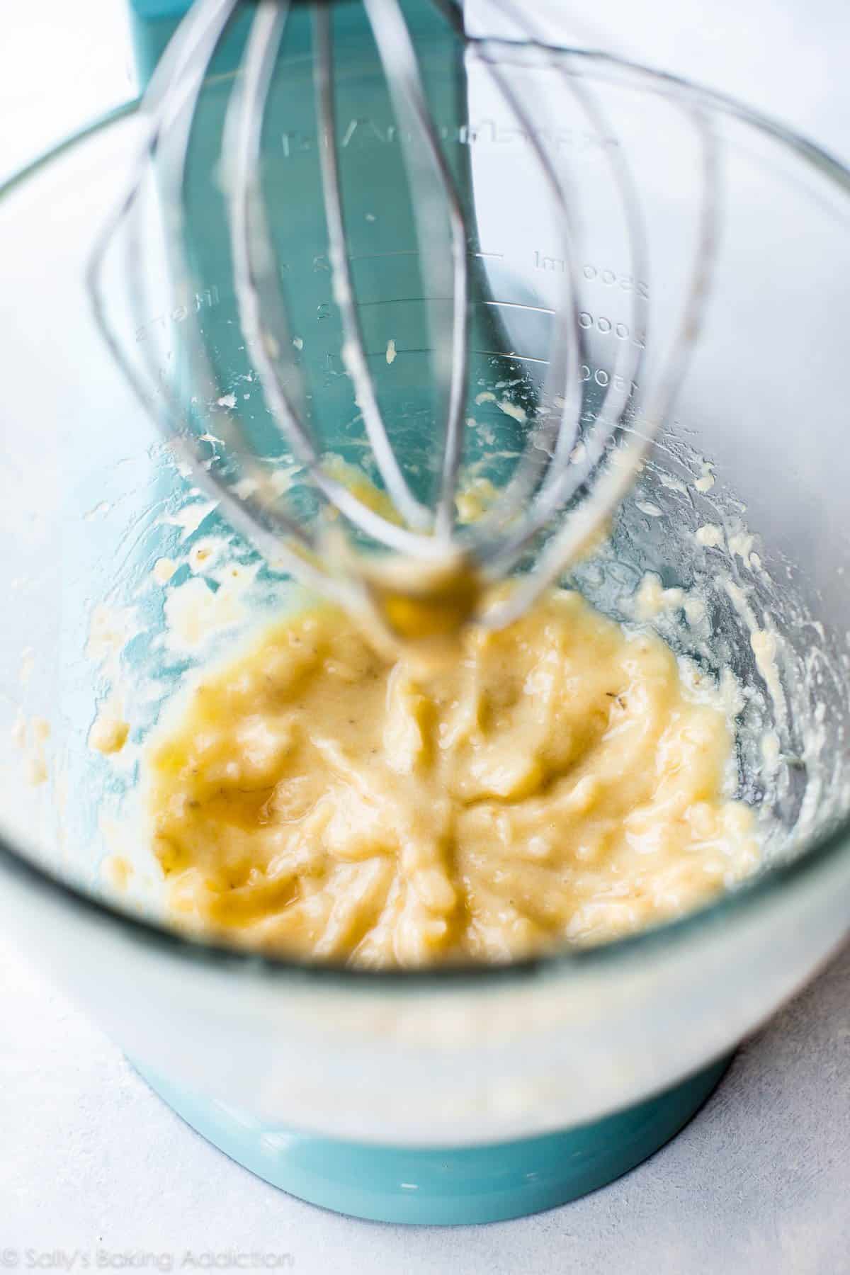 mashed bananas in a glass stand mixer bowl